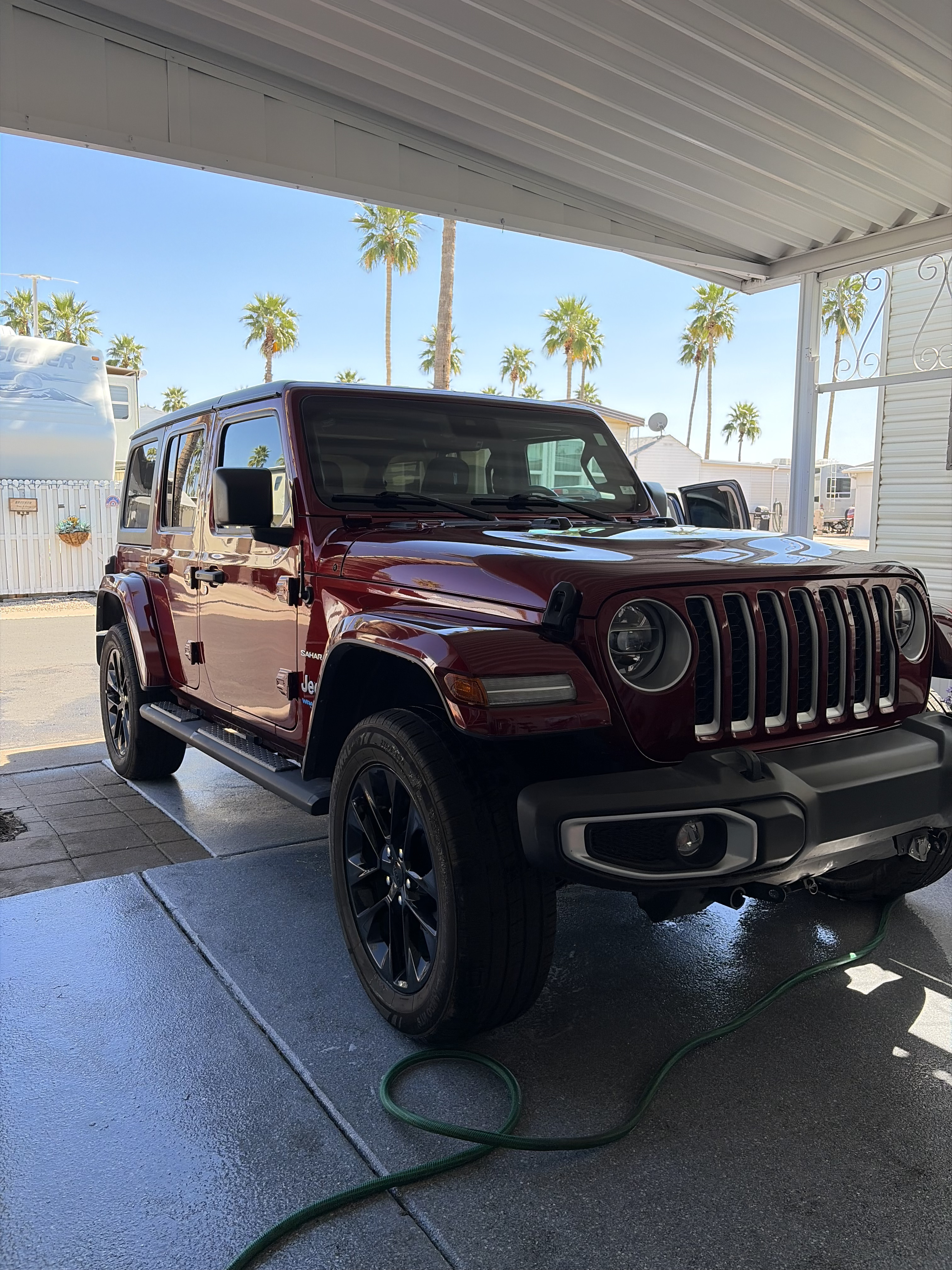 Shiny red Jeep after Phoenix auto detailing