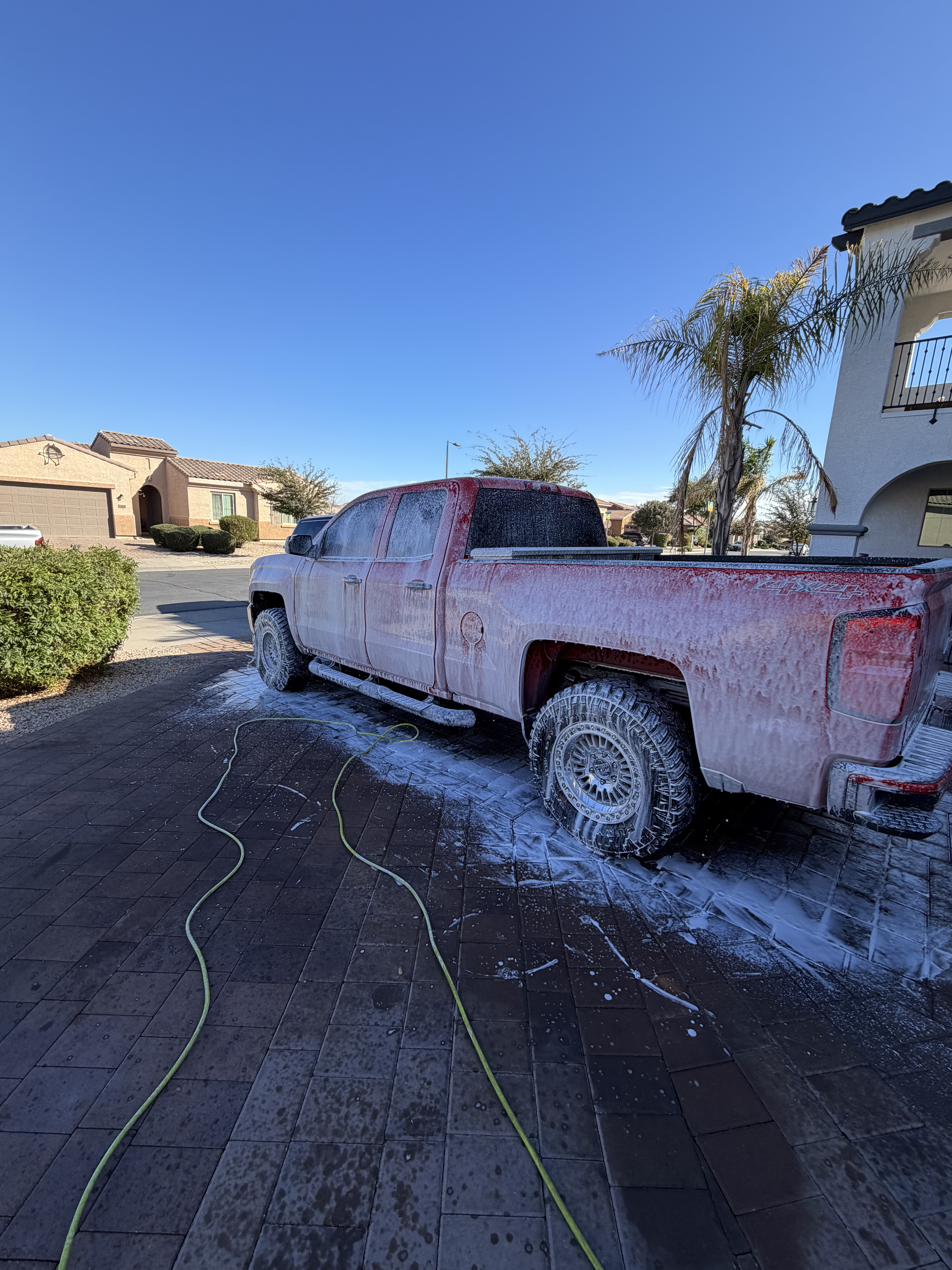 Mobile detailing foam wash on red truck in Phoenix AZ